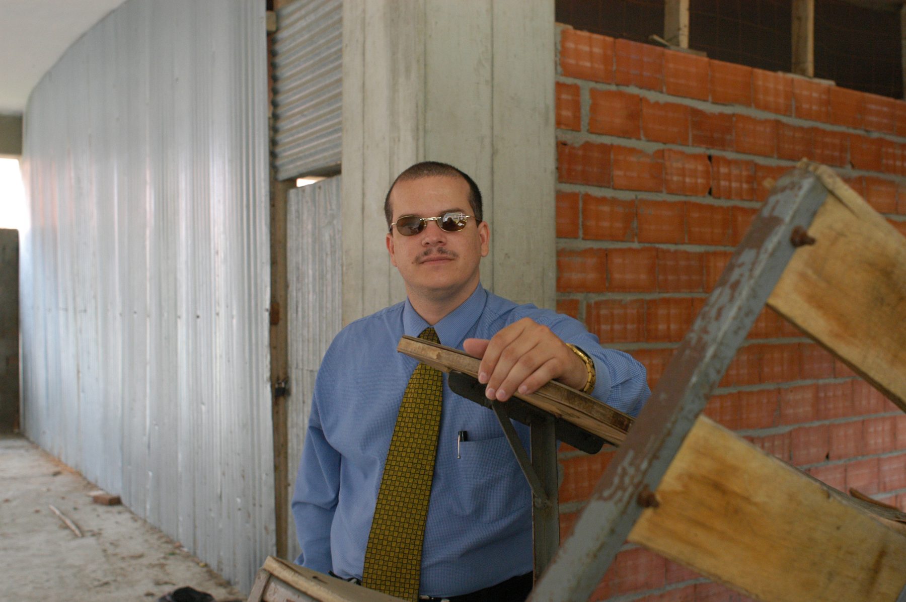 Fernando Báez documenting a damaged heritage site on location